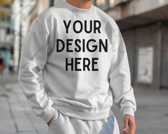 May include: A grey sweatshirt with the text "YOUR DESIGN HERE" printed on the front.
