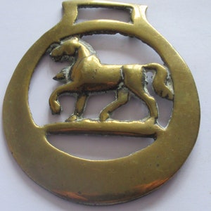 Antique Horse Brass Cantering Trotting Passant In A Crescent Surround  With Getts On Reverse