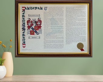 May include: A framed family crest document with a dark brown wooden frame. The crest features a shield with red, black, and blue elements, and the name "Spencer" is displayed below. The document includes text and a gold seal.