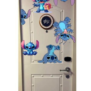 May include: A white door with multiple cartoon images of the character Stitch in various poses. The door has a circular sign with the number 9652. The door also has a silver handle and a keyhole.