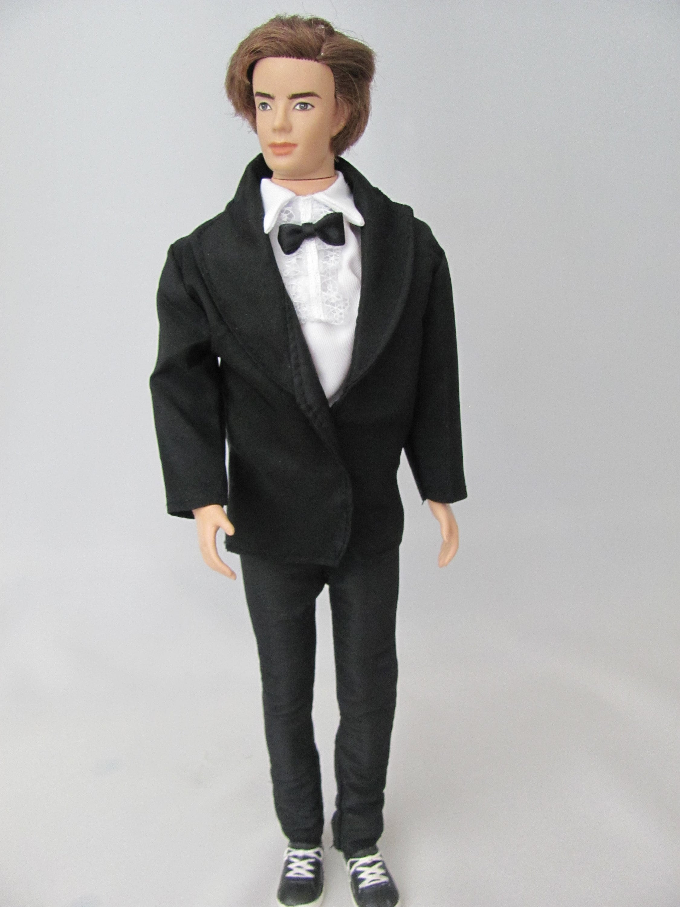 ken barbie doll in suit