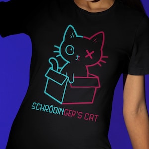 Maglietta fluorescente con il gatto di Schrödinger - divertente maglietta sulla fisica quantistica - gatto dei cartoni animati luminoso in una scatola - regalo per nerd della scienza - maglietta con umorismo scientifico geek