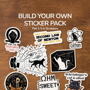 May include: A selection of science-themed stickers on a wooden background. The stickers feature designs such as a cat in a box, a cat in an atom, and mathematical equations. Text includes "Build Your Own Sticker Pack".
