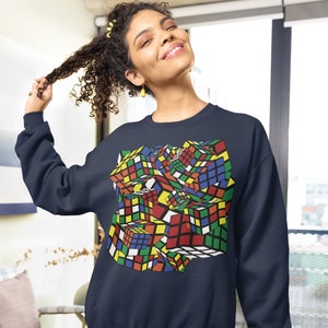 Rubiks cube sweatshirt, cubing fan, speed cube, solution, logic game, puzzle master, rotating toy, analytical thinking, multicolor, colorful