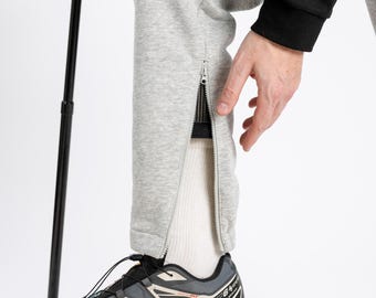 Pantaloni della tuta grigi da adulto con cerniera alla caviglia