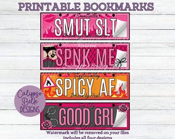 May include: Four printable bookmarks with a pink, orange, and black color scheme. Each bookmark features a different design with a license plate style border and text. The text on the bookmarks reads: "Smut Slt", "Spnk Me", "Spicy Af", and "Good Grl".