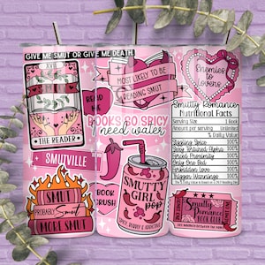 May include: A pink tumbler with various graphics and text related to romance novels. The design includes phrases like "Smutville," "Smutty Girl Pop," and "Enemies to Lovers." The tumbler also features a straw.