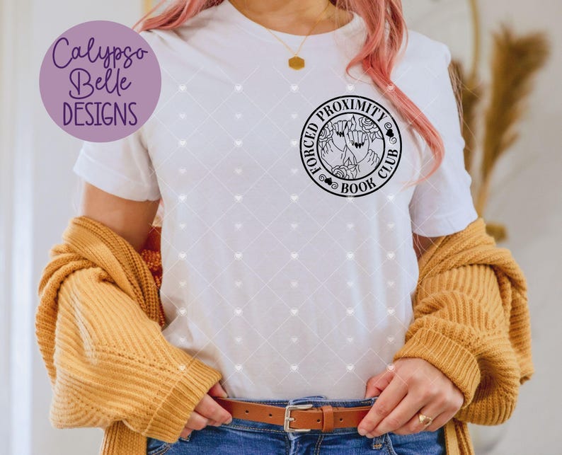 May include: White t-shirt featuring a black and white graphic design of a circle with the text "Forced Proximity Book Club" and a design of two hands holding a book.
