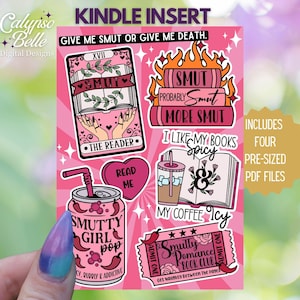 May include: A pink and white printable Kindle insert with four digital stickers featuring a book, a coffee cup, a can of pop, and a book club ticket. The text on the insert reads "Give me smut or give me death." and "Includes four pre-sized PDF files".