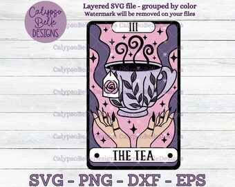 May include: A digital illustration of a tarot card featuring a teacup with steam, a tea bag with a rose, and hands. The card is labeled "THE TEA" and includes the text "SVG - PNG - DXF - EPS". The color scheme is purple, pink, and black.