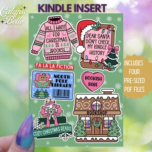 May include: Four printable Kindle insert designs featuring Christmas-themed illustrations and text. The designs include a pink sweater with the text "All I Want for Christmas is Books", a gingerbread house with the text "Bookshop", a heart with the text "Bookish Babe", and a North Pole Library with a bear wearing a pink sweater.