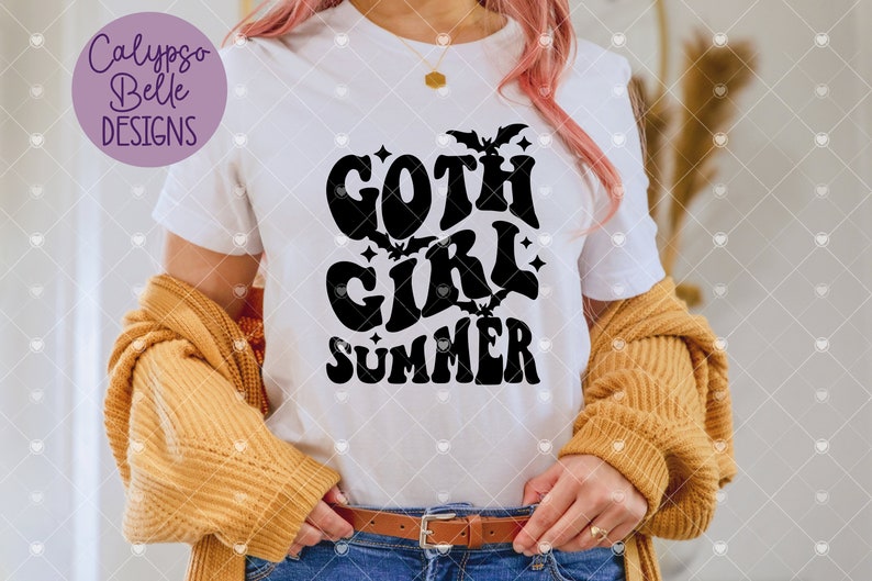 May include: White t-shirt with a black graphic that says "goth girl summer" with bats and stars around the text.