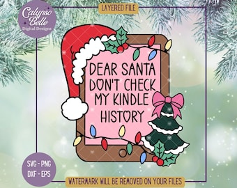 May include: A pink digital tablet with a brown frame and a white border. The tablet has a message that says "Dear Santa Don't Check My Kindle History". There is a green Christmas tree with a pink bow on top and a red Santa hat on the left side of the tablet.