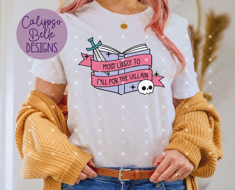 May include: White t-shirt with a pink and blue graphic of a stack of books with a sword and a skull. The text on the graphic reads "Most Likely to Fall for the Villain".