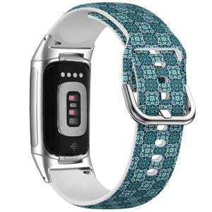May include: A silver and black fitness tracker with a white and patterned teal strap. The strap features a geometric design with a silver buckle. The tracker has a black screen and a white underside.