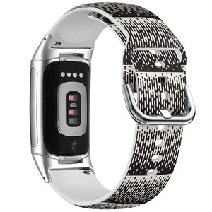 May include: A fitness tracker with a white and black patterned band. The tracker has a silver frame and a black screen with a display. The band features a repeating geometric design in black and white.