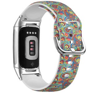 May include: A white and colorful paisley patterned silicone watch band with a silver metal watch face and a silver metal buckle.