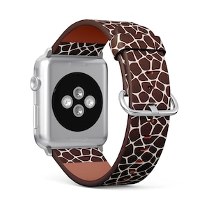 Può includere: Un cinturino per orologio in pelle marrone e bianco con motivo a macchie di giraffa e un quadrante Apple Watch argentato.