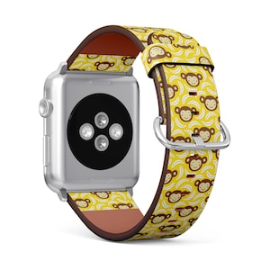 May include: A yellow and brown Apple Watch band with a pattern of monkeys and bananas. The band is made of leather and has a silver buckle.