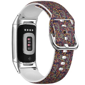 May include: A floral patterned smartwatch band with a navy blue background and a white underside. The band features a silver buckle and is attached to a black and silver smartwatch device.