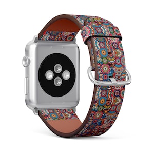 Puede incluir: Un Apple Watch plateado con una correa de cuero con estampado colorido. La correa presenta un patrón repetitivo de círculos y remolinos azules, rojos, amarillos y verdes.