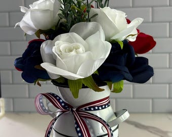 Patriotic floral centerpiece in a metal milk can vase