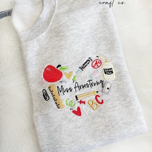 Embroidered Teacher Sweatshirt: Personalized School Supplies Design