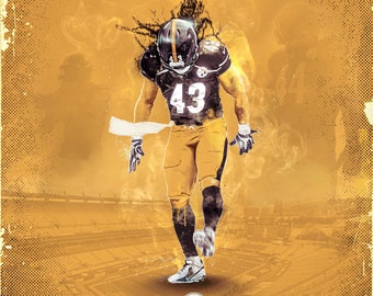 May include: A digital illustration of a football player wearing a black and gold uniform with the number 43 on the front. The player is standing on a field with a stadium in the background. The player's name, "Troy Polamalu", is written below the image.