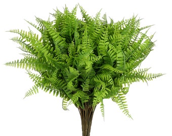 May include: A bunch of artificial green ferns with long, delicate fronds. The ferns are arranged in a bouquet and have a natural, realistic appearance.