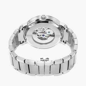 May include: A silver-toned wristwatch with a transparent back, showcasing the intricate internal gears. The watch features a round face and a linked metal band. The watch is designed with a classic aesthetic.