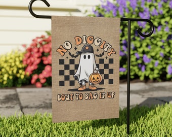 May include: A Halloween garden flag with a ghost wearing a backwards baseball cap and holding a jack-o'-lantern. The flag reads "NO DIGGITY BOUT TO BAG IT UP" in orange and black lettering, with a checkered background.