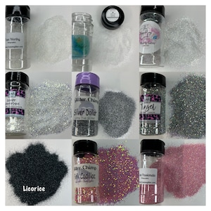 May include: Assortment of glitter jars in various colors, including silver, black, pink, and white. The jars are labeled with names like "Silver Dollar", "Pink Cadillac", "Licorice", and "Winter Wonderland".