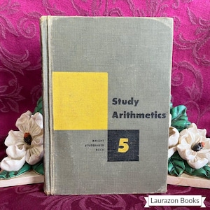 May include: Vintage textbook titled "Study Arithmetics 5" with a gray cover and a yellow square. The book's title and the number 5 are in black and yellow. The book is from Knight, Studebaker, and Ruch.
