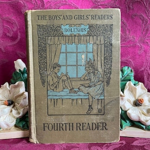 May include: Vintage "The Boys' and Girls' Readers" Fourth Reader book. The cover is tan with a detailed illustration of two children reading by a window. The title and author's name are printed in black and blue.