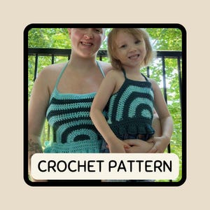 May include: Two crochet halter tops, one worn by an adult and the other by a child. The tops are teal and dark teal, with a striped pattern. The text "CROCHET PATTERN" is displayed in a white rectangle at the bottom.