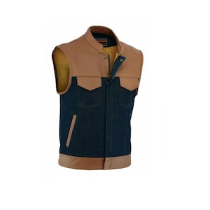 May include: A blue denim vest with brown leather trim around the collar, pockets, and bottom. The vest has a zipper closure and a label that reads "Remarkable" on the collar.