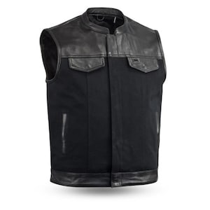 May include: Black leather and denim motorcycle vest with a snap closure. The vest has a collar and two pockets.