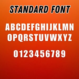May include: A digital graphic displaying the text STANDARD FONT in black at the top, followed by the complete uppercase English alphabet from A to Z and the digits 0 through 9 in white, all set against a solid, vibrant orange background.