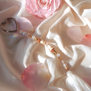 Heishi pearl heart key ring with its creamy white pompom