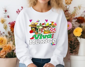 Pode incluir: Camisola branca com um gráfico colorido de comida mexicana e o texto "Viva: México".
