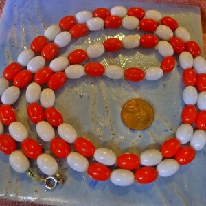 Red and White Oval Bead Necklace. 35 Inches Full Circumference