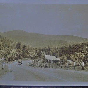 May include: A black and white vintage photograph of a road winding through a mountainous landscape. The text "Haystack Mt. Molly Stark Trail Route #" is visible in the lower left corner of the image.
