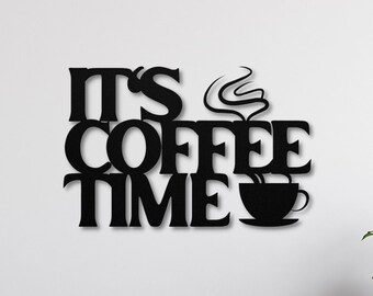 May include: Black metal wall decor with the text "It's Coffee Time" and a stylized coffee cup with steam rising from it.