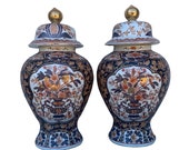 A Fabulous Pair of Large Antique 18th Century Imari Vases and Covers.