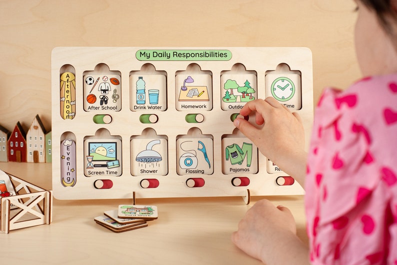 May include: A wooden board with a green header that reads "My Daily Responsibilities". The board has 12 slots with images and text labels for daily activities, such as "After School", "Drink Water", "Homework", "Outdoor Time", "Screen Time", "Shower", "Flossing", "Pajamas", and "Reading". Each slot has a toggle switch.