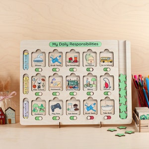 May include: A wooden board with a green header that says "My Daily Responsibilities". The board has 18 squares with pictures and text representing daily activities. The squares are organized into three columns labeled "Morning", "Afternoon", and "Evening".  The activities include "Shower", "Brush Teeth", "Eat Breakfast", "Pack Backpack", "Go to School", "After School", "Homework", "Practice Music", "Biking", "Vacuum", "Outdoors", "Play Time", "Eat Dinner", "Brush Teeth", and "Take Bath".
