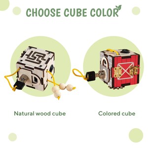 May include: Choose cube colour: a natural wood cube with a keyhole, a maze, and a string of wooden beads, and a red and white coloured cube with a keyhole, a door, and a latch.