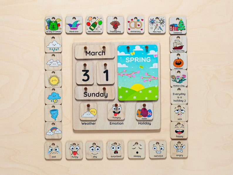 May include: Wooden calendar with a variety of colourful wooden tiles. The calendar shows the date 31st March and the day of the week Sunday. The tiles include images of holidays, weather, emotions, and other themes.