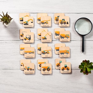 a bunch of wooden coasters with construction vehicles on them