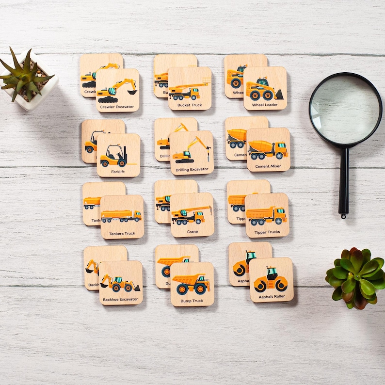 a bunch of wooden coasters with construction vehicles on them